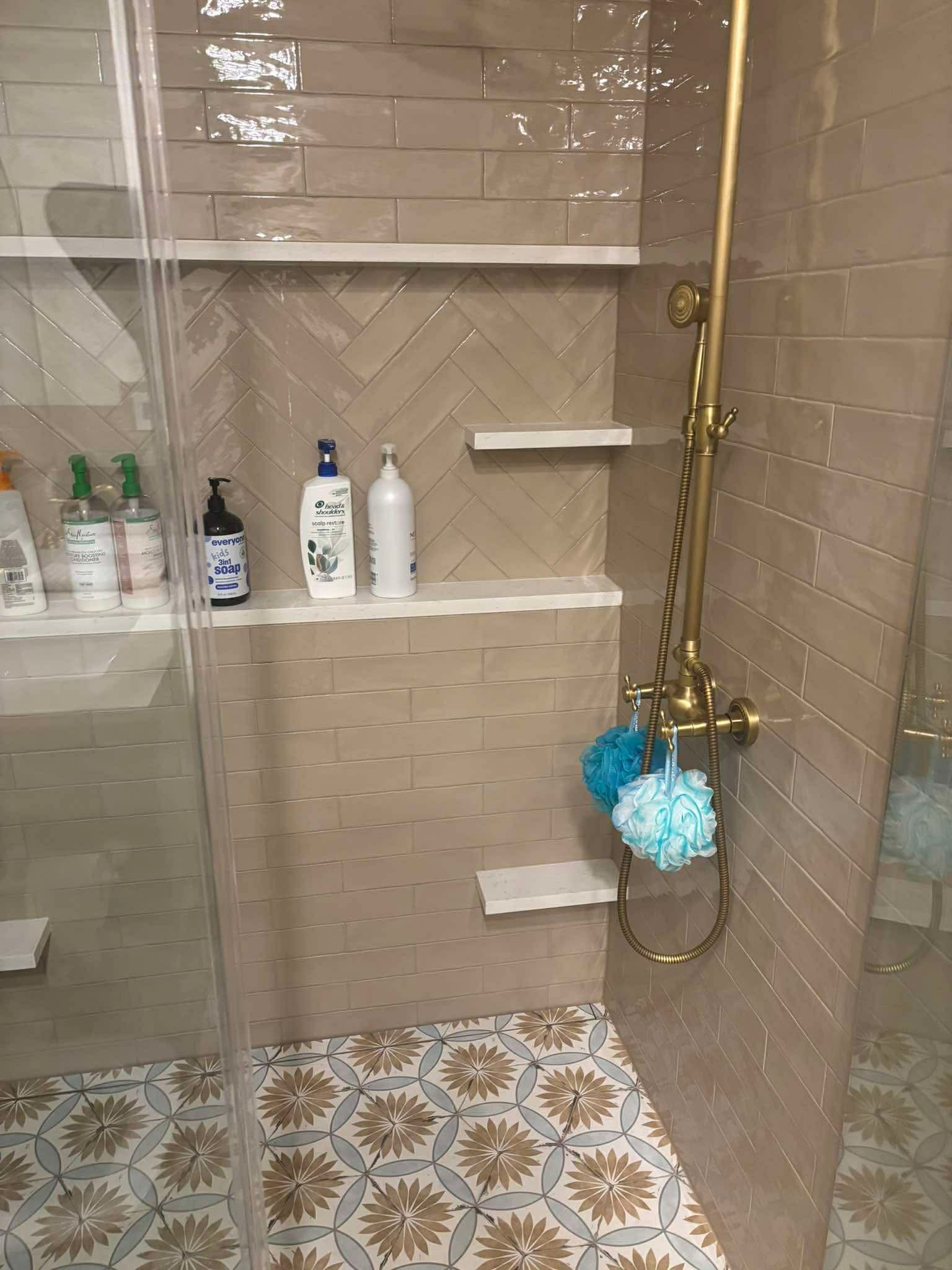 Sleek curbless tiled walk-in shower detail